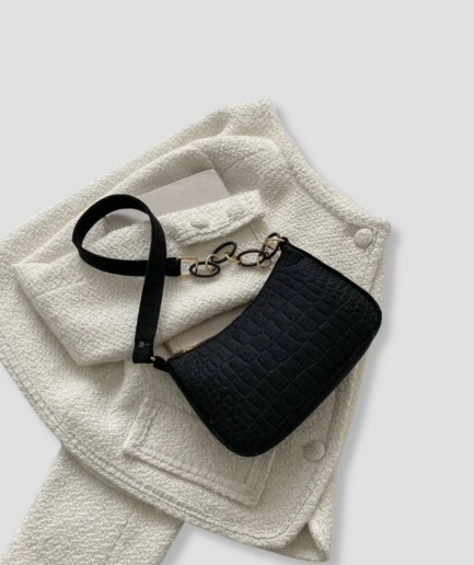 black-handbag-hand-and-shoulder.png
