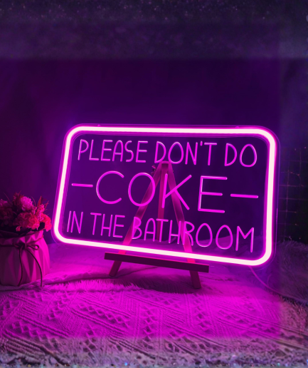 neon sign: "Please don't do"
