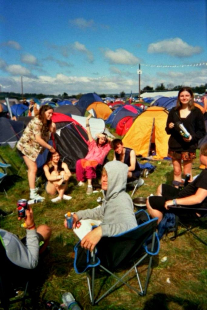 Camping at a festival with tents and camping chairs