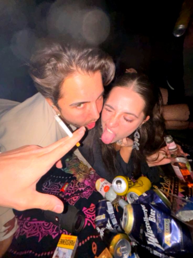 Take a photo of the two of you together at a festival in the evening